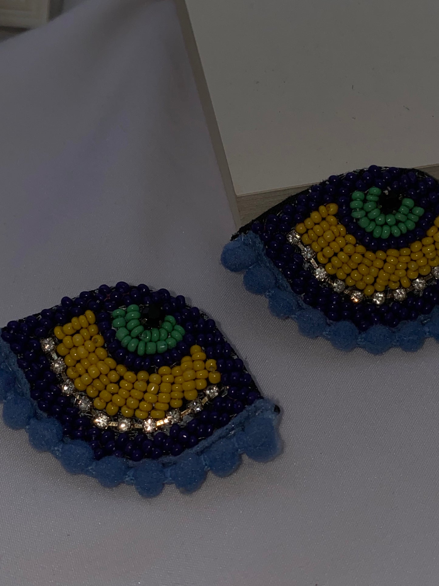Evil eye statement studs